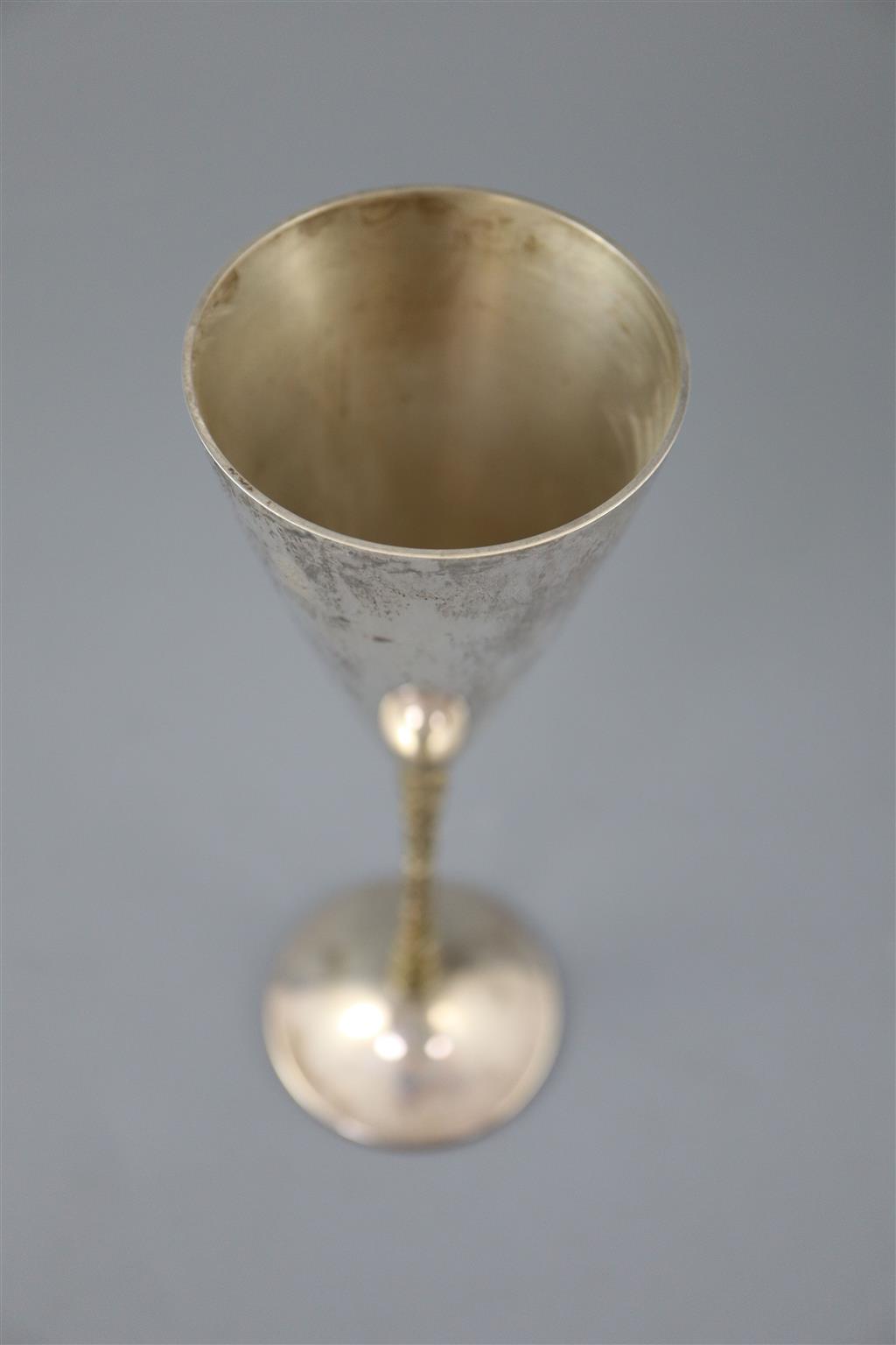 A set of six modern Stewart Devlin parcel gilt silver goblets (Senior Falcon Award 1979 & 1980) in two fitted cases (4 & 2),